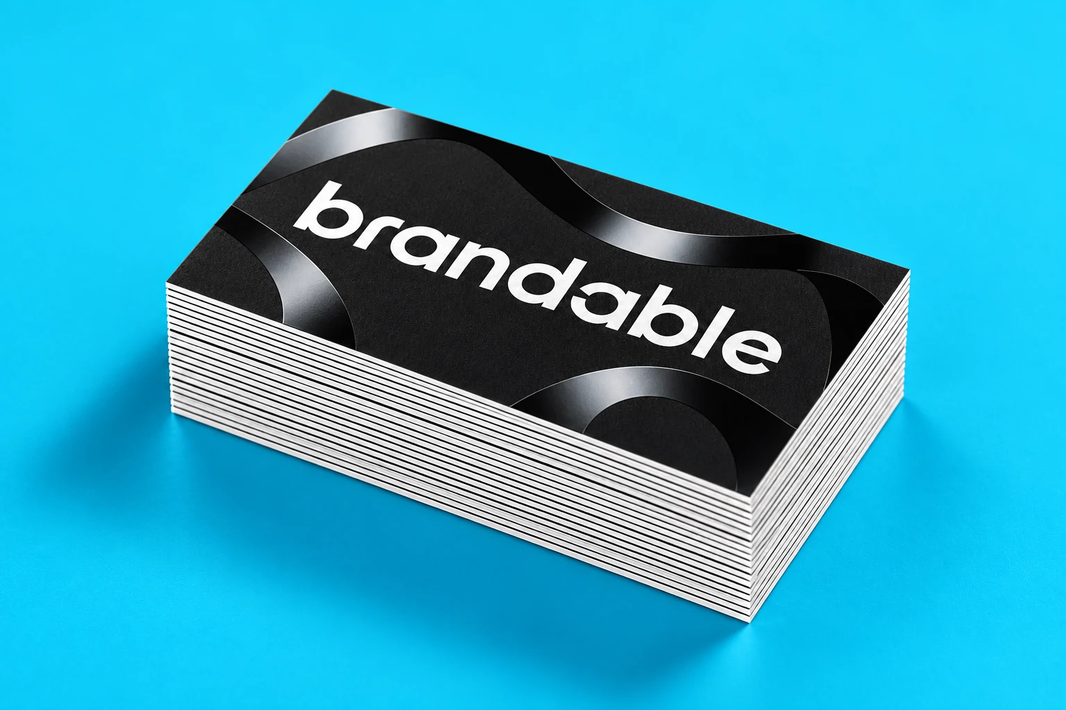 Matte black Brandable cards with reflective spot UV details on turquoise